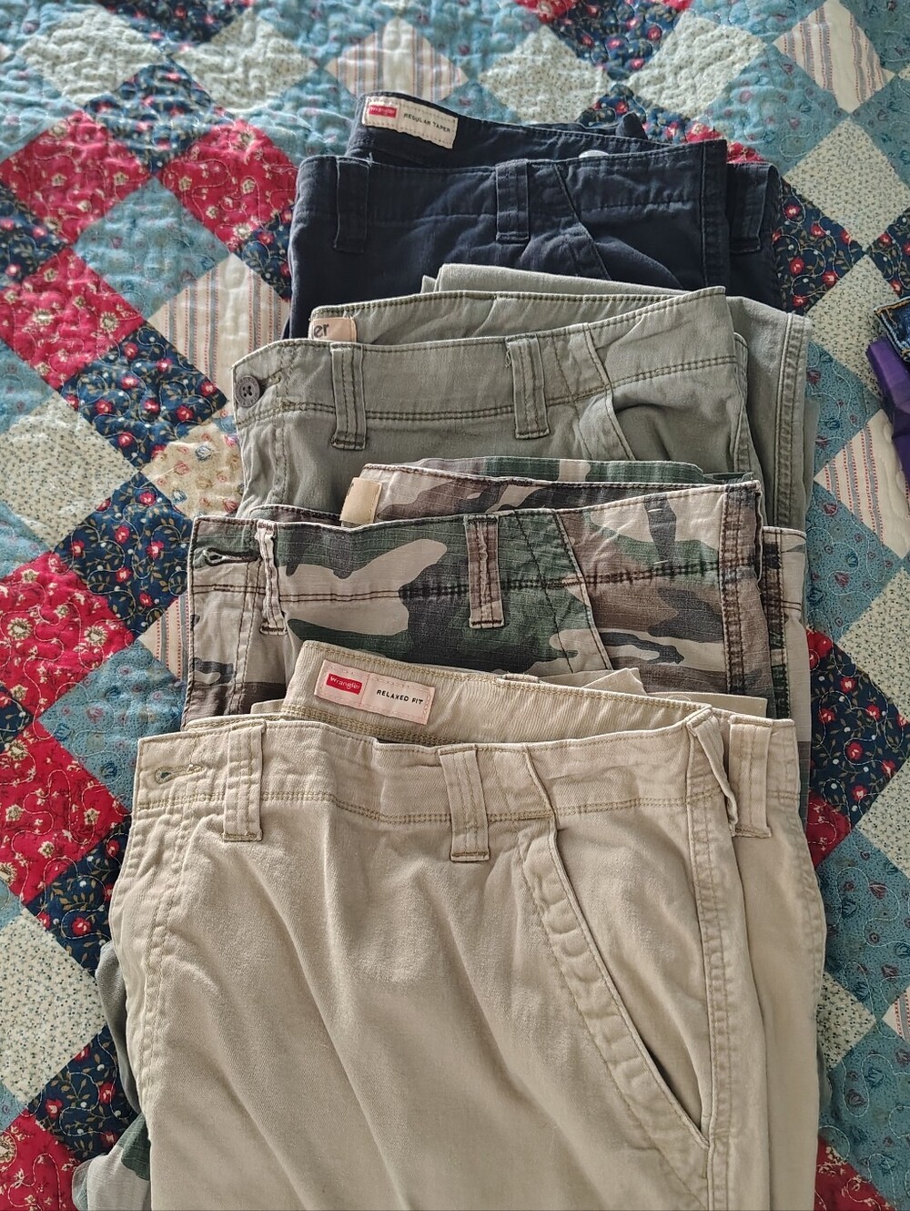 Stack of Casual Men's Pants - Neutral & Camo Colors